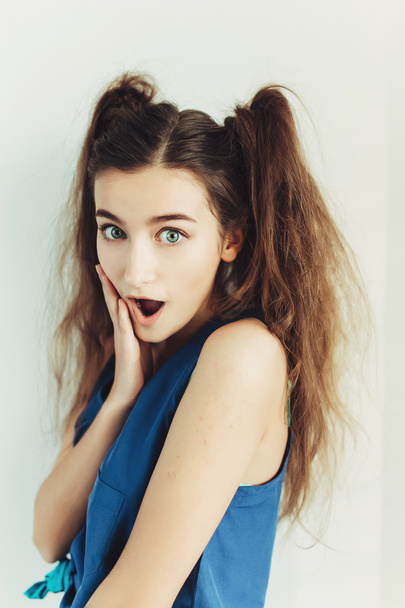 Surprised young girl with pigtails - Foto, afbeelding