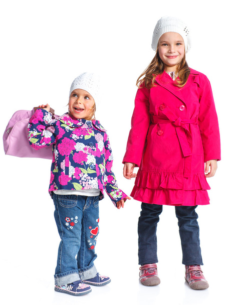 Young beautiful girls in a beret and coat - Фото, изображение