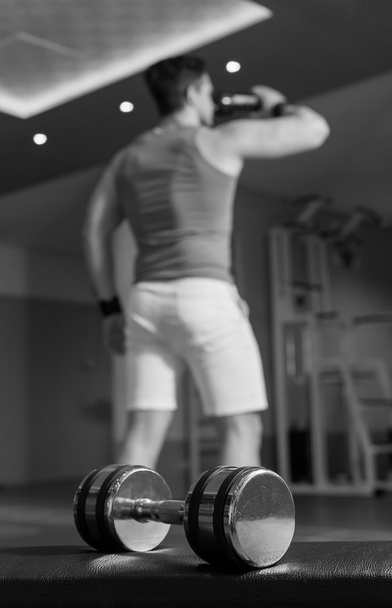 dumbbell on the gym floor - Photo, image