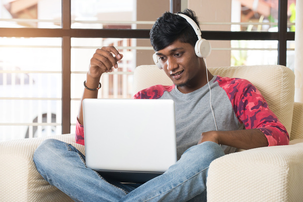 Indian man listening to music   - Fotografie, Obrázek