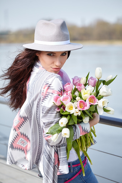 woman with bouquet of tulips  - Фото, изображение