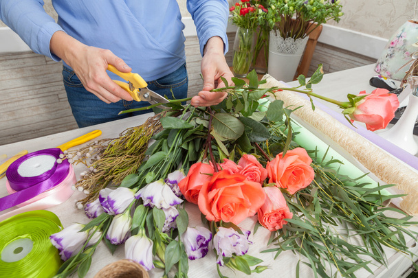 Florist at work with flowers - Фото, зображення