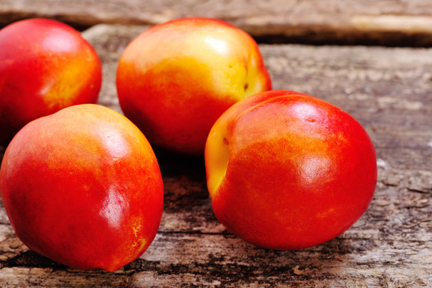 Fresh peaches on the table, delicious, juicy, tasteful - Fotoğraf, Görsel