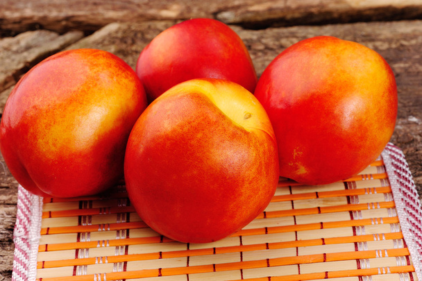 Fresh peaches on the table, delicious, juicy, tasteful - Foto, Imagem