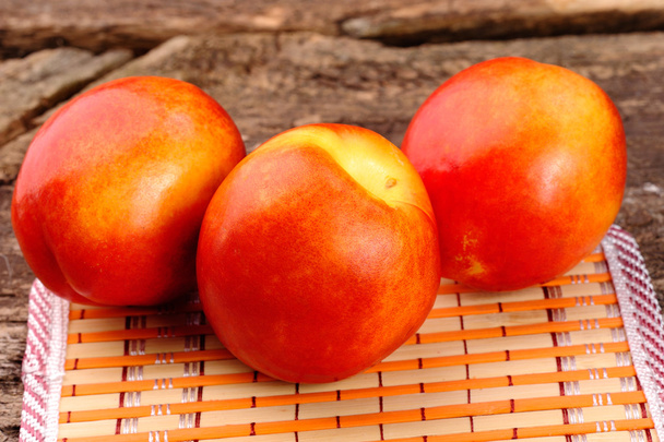 Fresh peaches on the table, delicious, juicy, tasteful - Foto, Bild