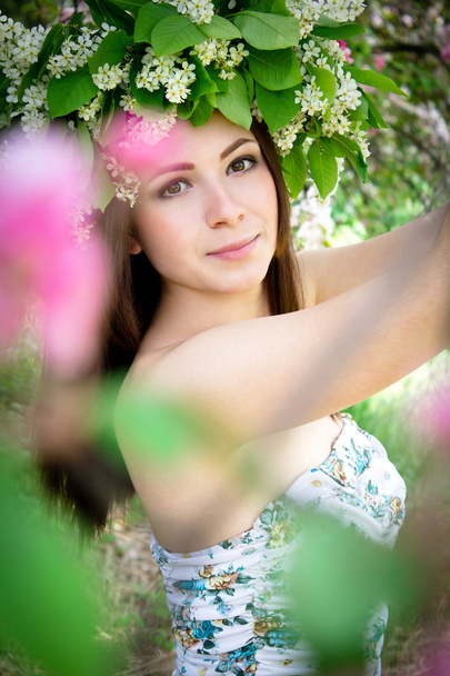Beautiful young woman in the spring garden - Zdjęcie, obraz