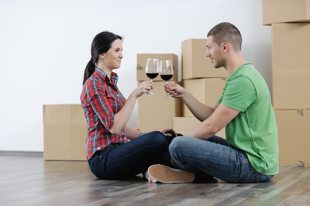 Young couple moving in new house - Photo, image