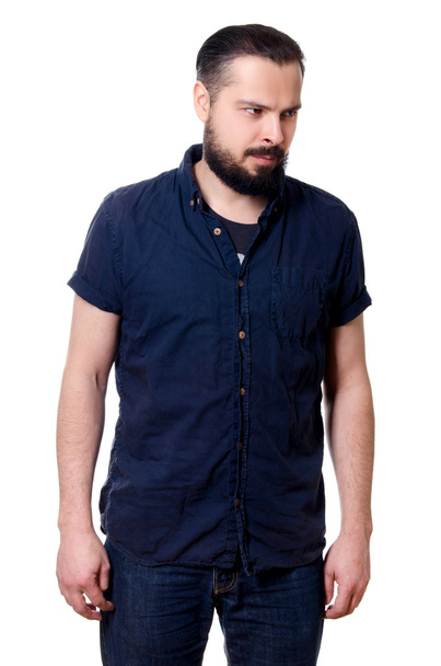 Portrait of a young bearded man on a white background - Photo, Image