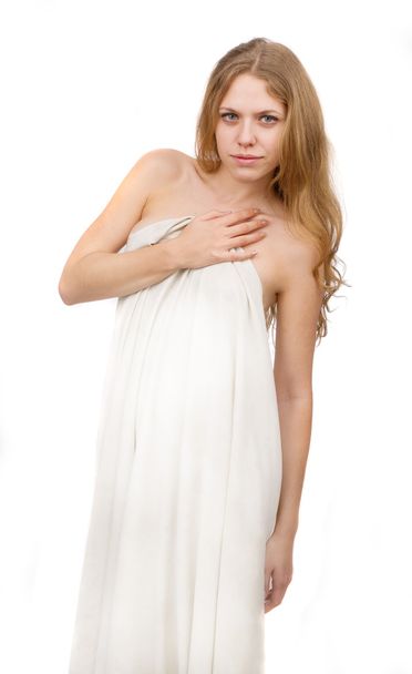 Beautiful girl, covered with white cloth, on a white background. - Photo, image