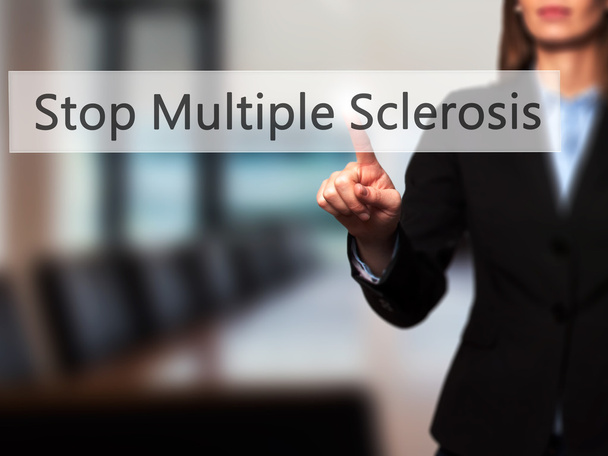 Stop Multiple Sclerosis - Businesswoman hand pressing button on  - Photo, Image