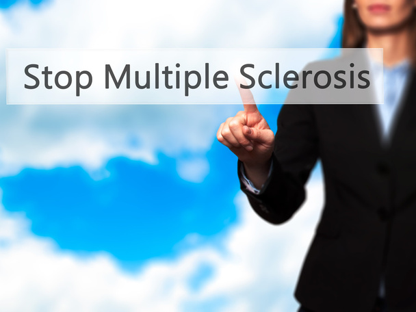 Stop Multiple Sclerosis - Businesswoman hand pressing button on  - Photo, Image