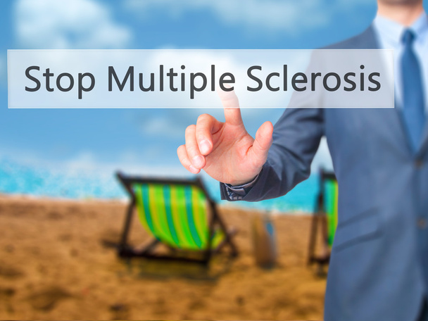 Stop Multiple Sclerosis - Businessman hand pressing button on to - Photo, Image