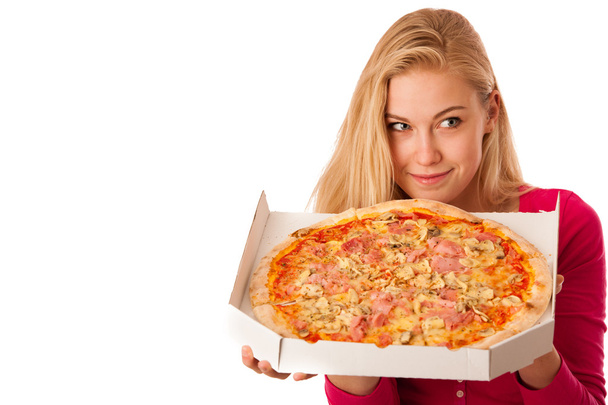 Woman with big pizza in carton box can't wait to eat it.  - Foto, Bild