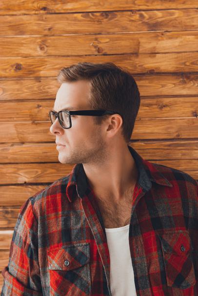 Close up portrait of pretty man in checkered red shirt and glass - Foto, imagen