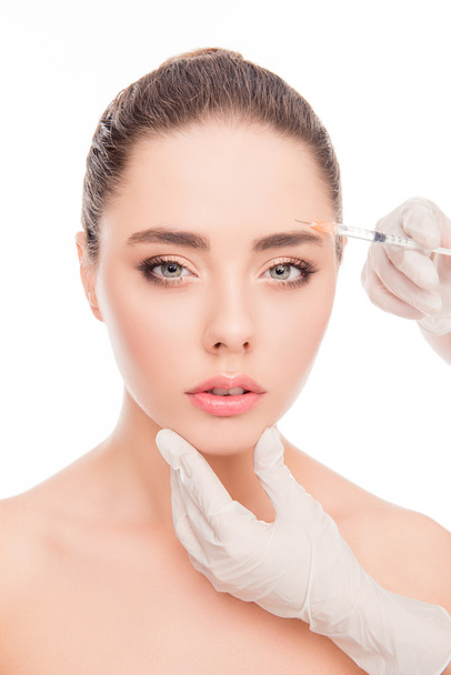 Close up portrait of young  woman getting cosmetic injection  - Foto, immagini