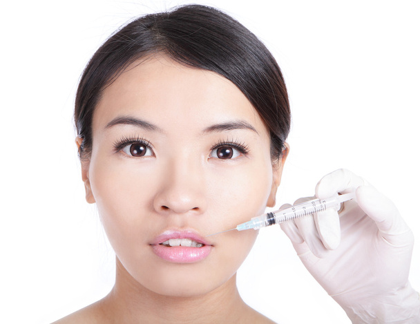 Woman receiving a injection in her lip - Φωτογραφία, εικόνα