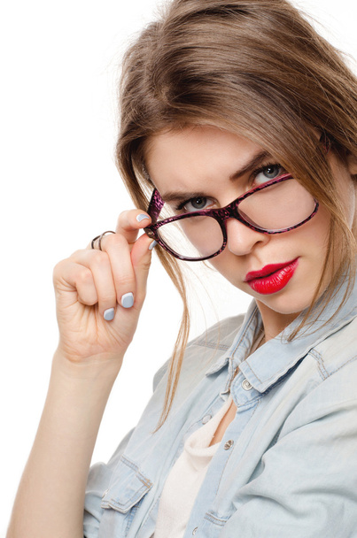 Woman in glasses on white background looking suspiciously - Photo, Image
