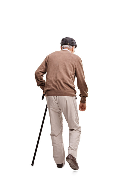 Old man walking with a black cane  - Фото, изображение