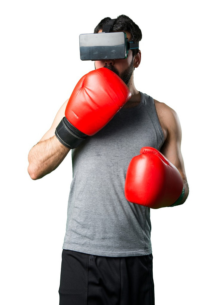 Sportman with boxing gloves and VR glasses - Foto, imagen