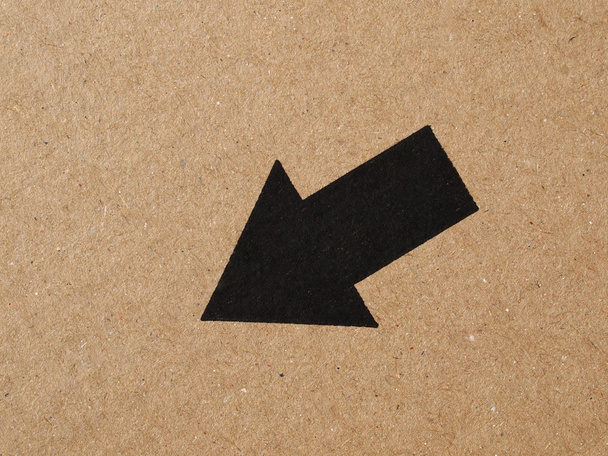 Black arrow on cardboard - Photo, Image