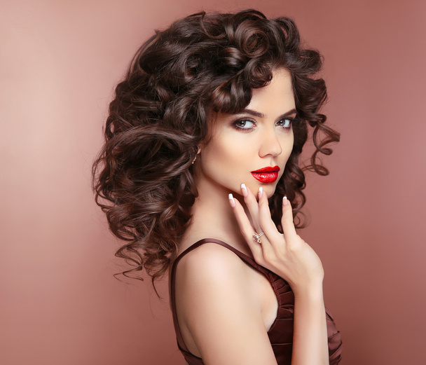 Makeup. Hair. Manicured nails. Brunette woman with red lips and  - Fotó, kép