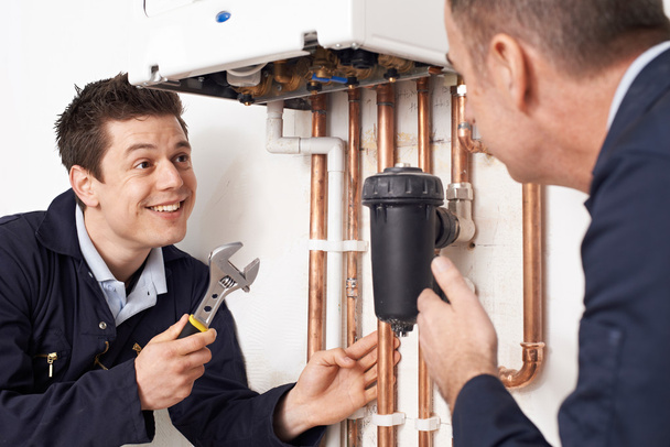 Trainee Plumber Working On Central Heating Boiler - Photo, Image