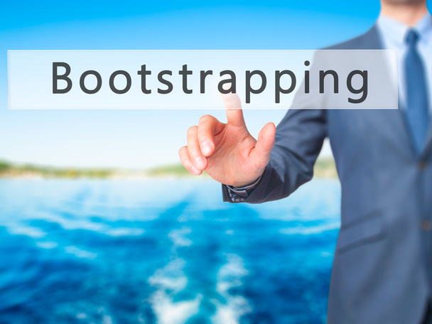 Bootstrap - biznesmen ręcznie naciskając przycisk na ekranie dotykowym - Zdjęcie, obraz
