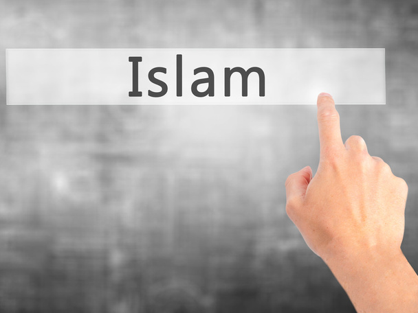 Islam - Mano presionando un botón sobre el concepto de fondo borroso en
  - Foto, imagen