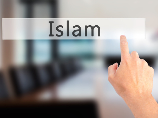 Islam - Mano premendo un pulsante sul concetto di sfondo sfocato su
  - Foto, immagini