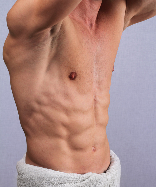 Muscular male torso, chest and armpit hair removal close up. Male Brazilian Waxing treatment  - Foto, Imagen
