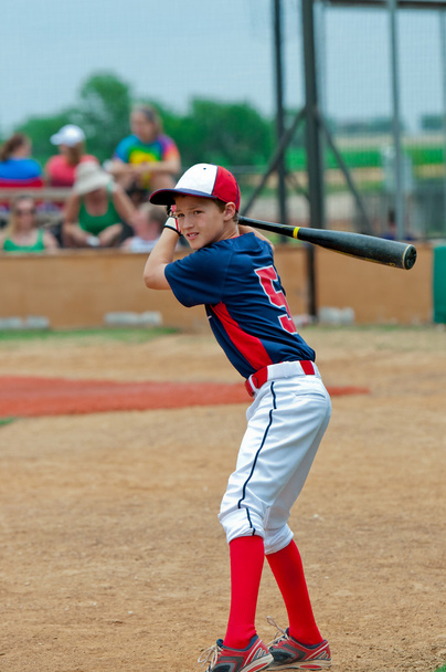 Cute baseball player holding a bat. - Photo, Image