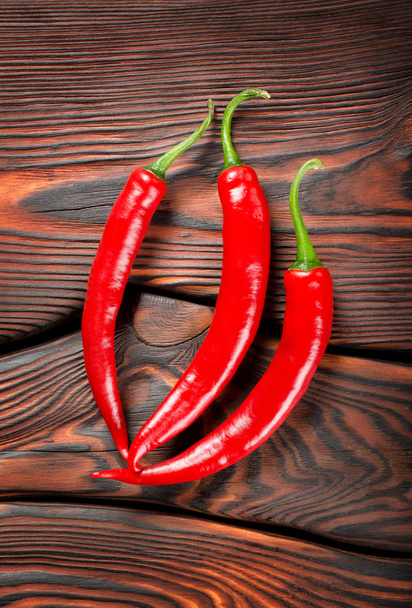 drie rode chili pepers - Foto, afbeelding