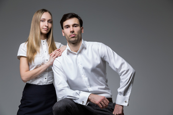 Businesswoman and man isolated on grey background - Fotó, kép