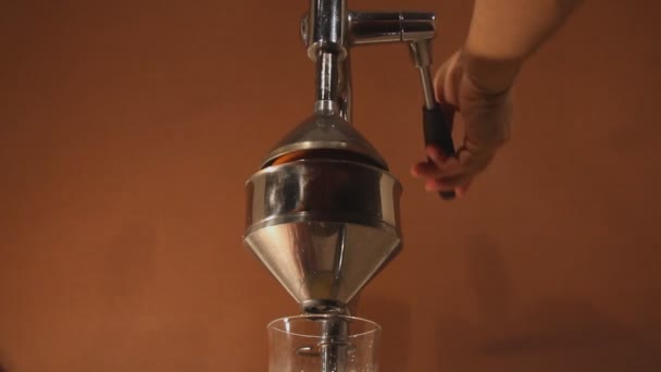 preparation orange juice by chrom  press juicer - Footage, Video