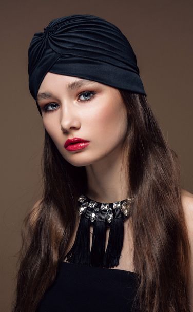 Portrait Beautiful fashion east woman. Indian arabic girl with black turban. - Фото, изображение