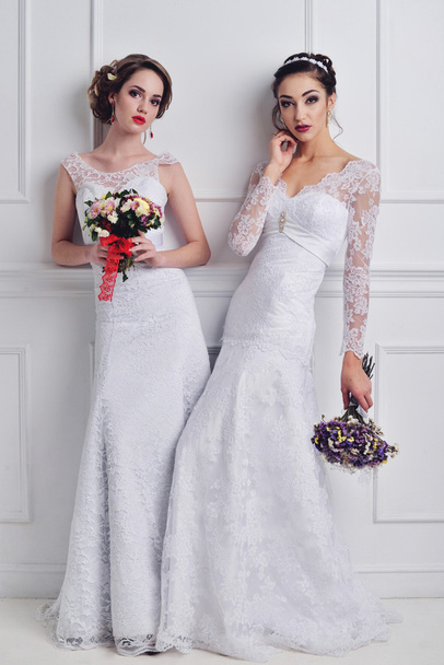 Two beautiful bride posing together - Foto, afbeelding