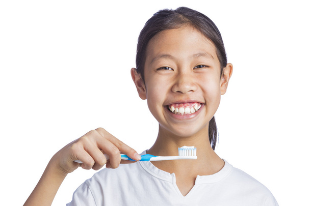 Asian girl holding toothbrush - Photo, Image