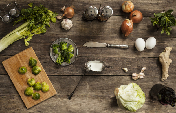 cabbage, tomatoes, garlic and onions on old wooden table - Fotografie, Obrázek