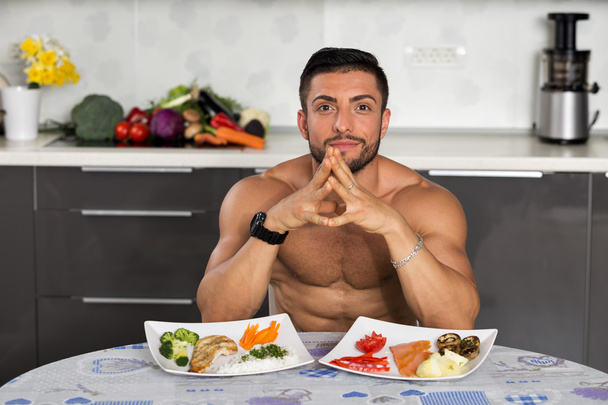 young bodybuilder in the kitchen - Photo, Image
