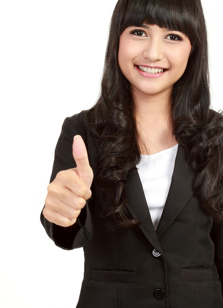Beautiful businesswoman showing thumbs up - Photo, image