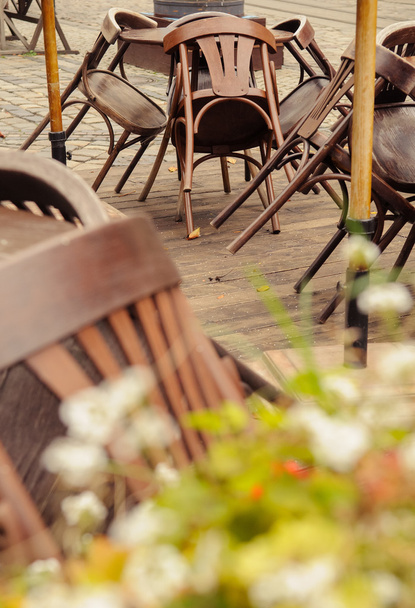 Piled chairs on terrace - 写真・画像