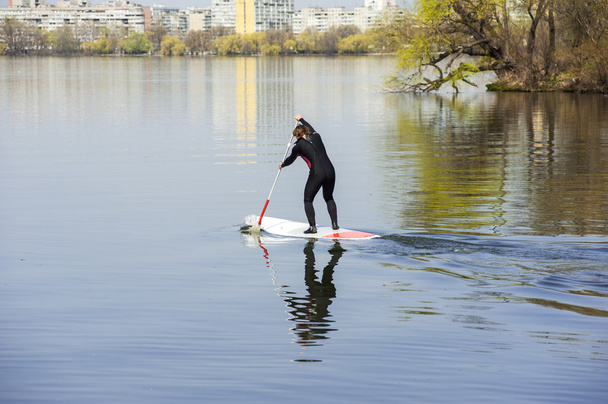 athletic man stand up paddle board SUP - Foto, Bild