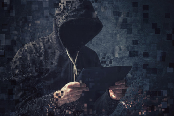 Pixelated unrecognizable hooded cyber criminal - Foto, immagini