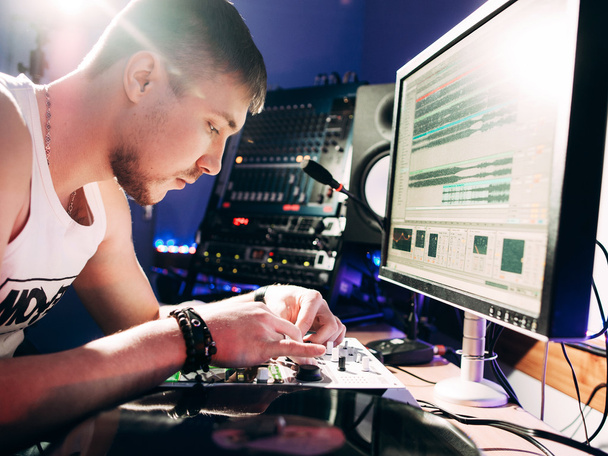 DJ adjusts music equipment before starting work - Фото, изображение