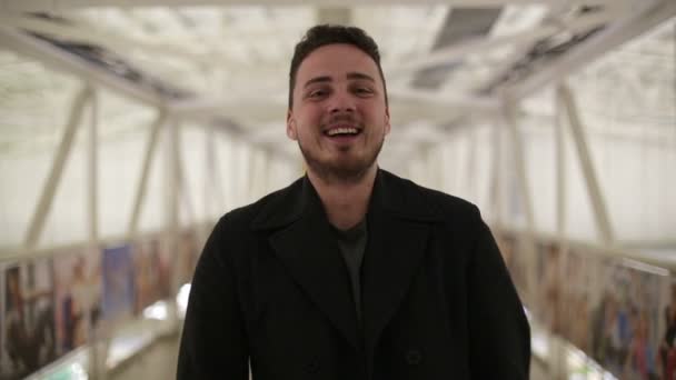 Young man laughing on the bridge - Video, Çekim