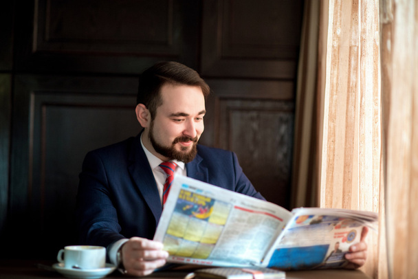 successful businessman reading a newspaper - Photo, Image