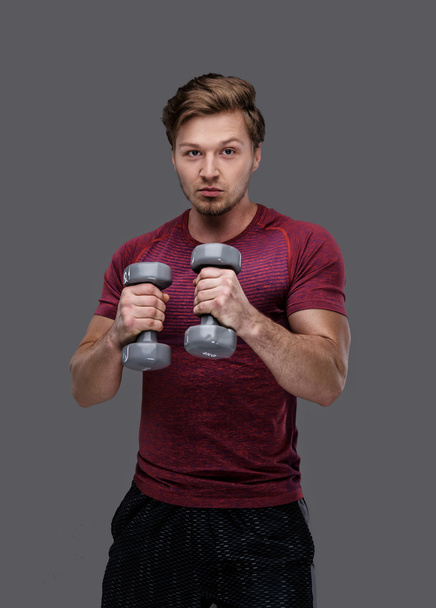 man holds pair of dumbbells - Photo, Image