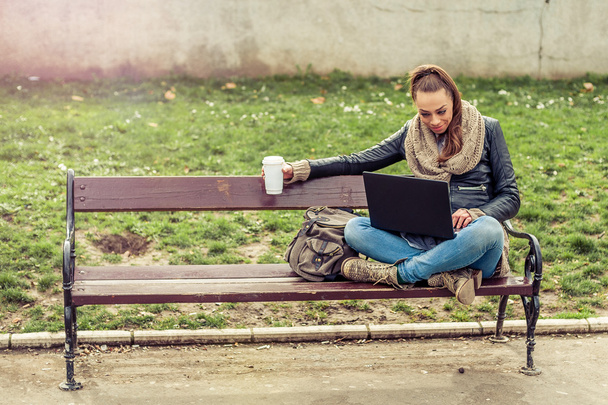 Young student Using laptop in park - Φωτογραφία, εικόνα