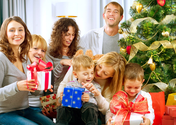 Happy Big family holding Christmas presents at home.Christmas tr - Photo, Image