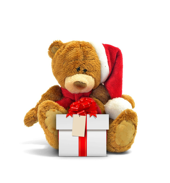 Αρκουδάκι και συσκευασία δώρου με κόκκινη κορδέλα - Φωτογραφία, εικόνα